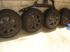 4 USED BLACK RIMS AND TIRES.. 